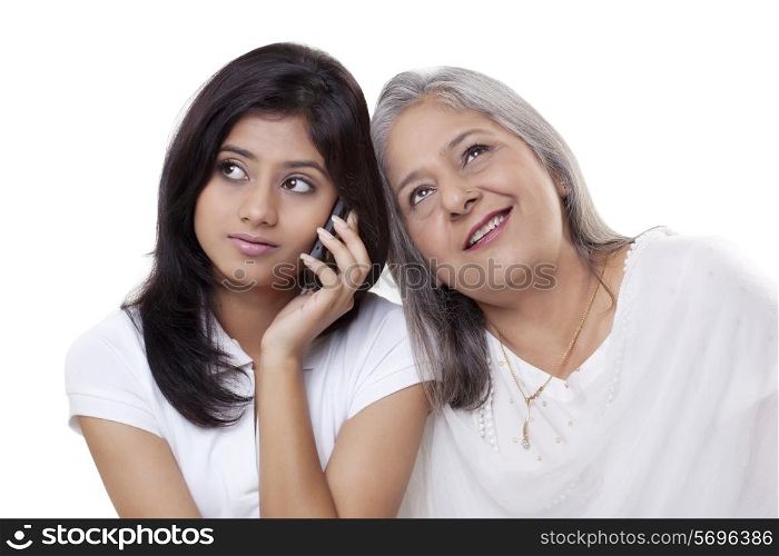 Girl on call while grandmother listening her conversation