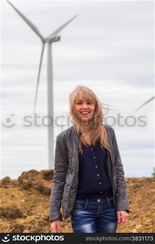 girl on nature near windmill