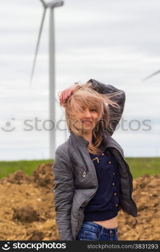 girl on nature near windmill