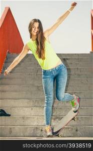Girl on stairs with skateboard.. Cool skate young long haired girl riding skateboard on the urban stairs. Active lifestyle funky in summer. Outdoor trendy sport teen.