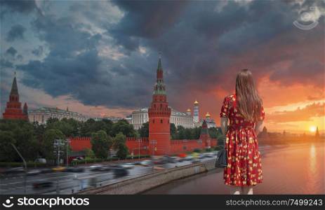 girl on the background of the Kremlin in Moscow. Russia.