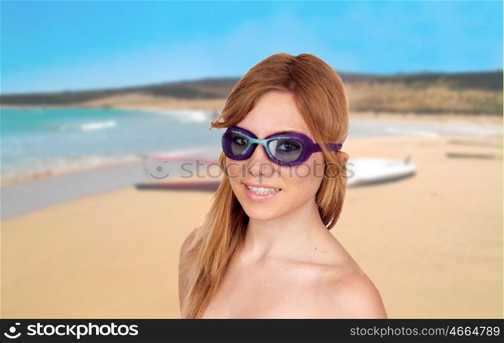 Girl on the beach with swimming goggles