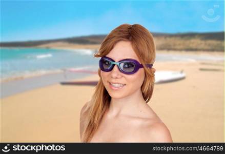 Girl on the beach with swimming goggles