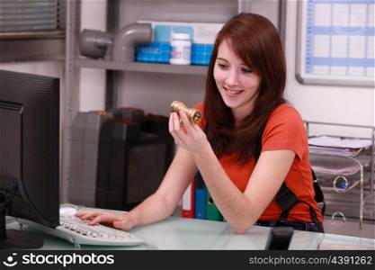 Girl ordering pipes on the computer