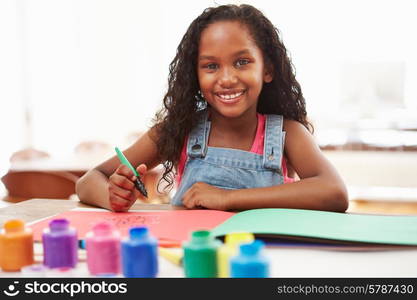 Girl Painting Picture On Table At Home