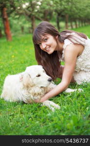 Girl play with golden retriever in park