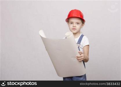 Girl playing Builder launched the drawing up and looks into the drawing