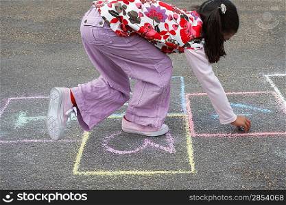 Girl Playing Hopscotch