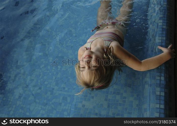 Girl playing in pool
