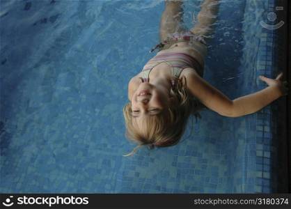 Girl playing in pool