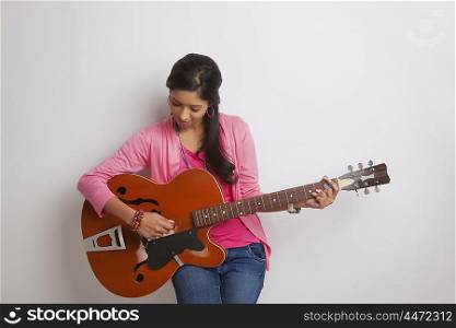 Girl playing on guitar