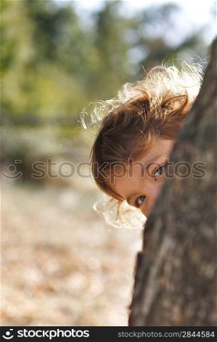 Girl playing peekaboo