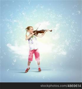Girl playing violin. Image of cute girl playing violin against blue background