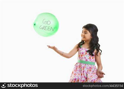 Girl playing with a balloon