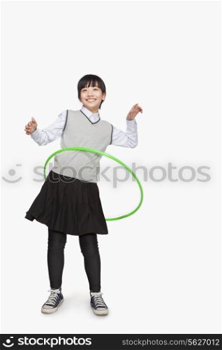 Girl playing with hula hoop
