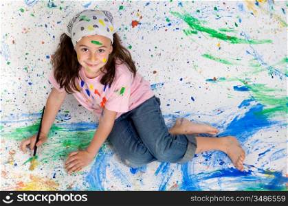 Girl playing with painting with the background painted