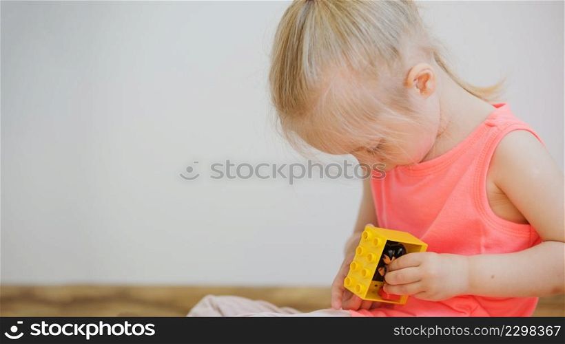 girl playing with toy