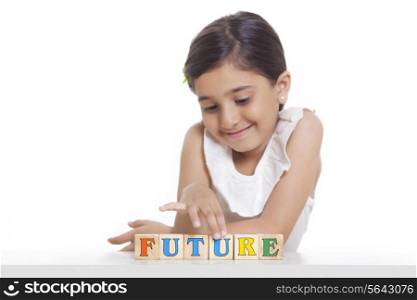 Girl playing with wooden blocks