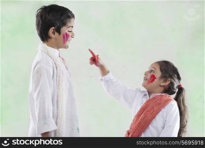 Girl pointing at a boy