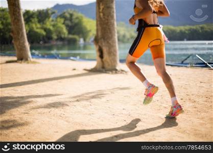 Girl practicing athletics beside a lake