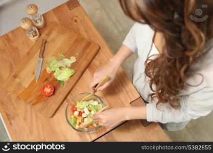 Girl preparing salad