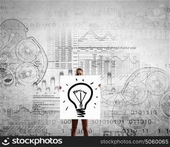 Girl presenting her idea. Young girl with white banner with idea bulb and sketches at background