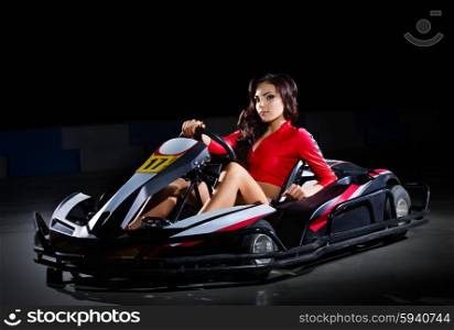 Girl racer with kart isolated