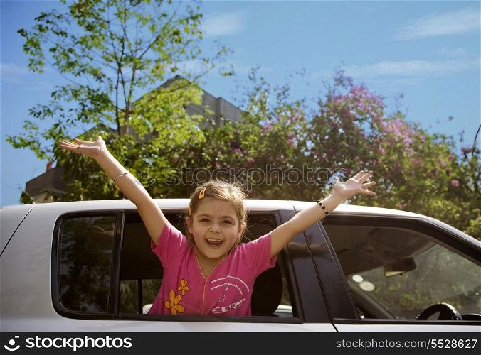 Girl raising her arms