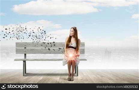 Girl reading book. Asian pretty woman sitting on bench and reading book
