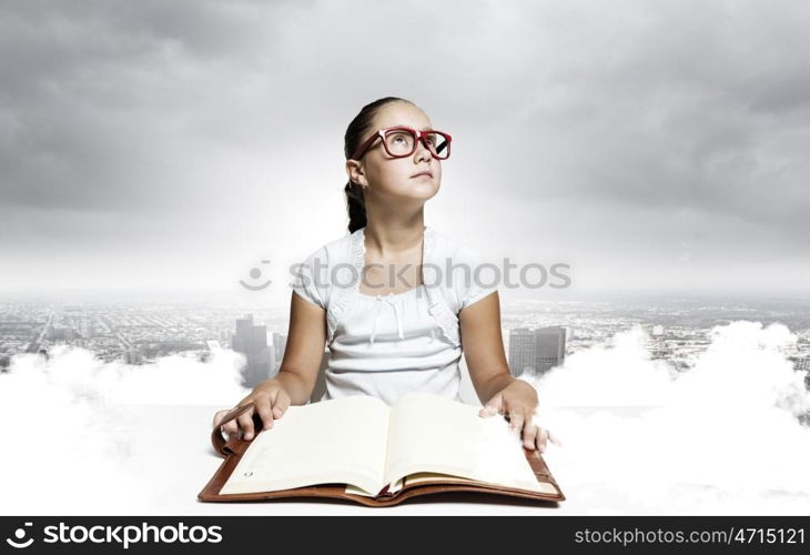 Girl reading book. School pretty girl in red glasses reading book