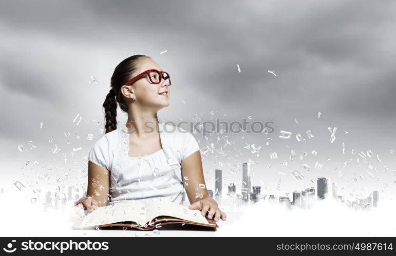 Girl reading book. School pretty girl in red glasses reading book