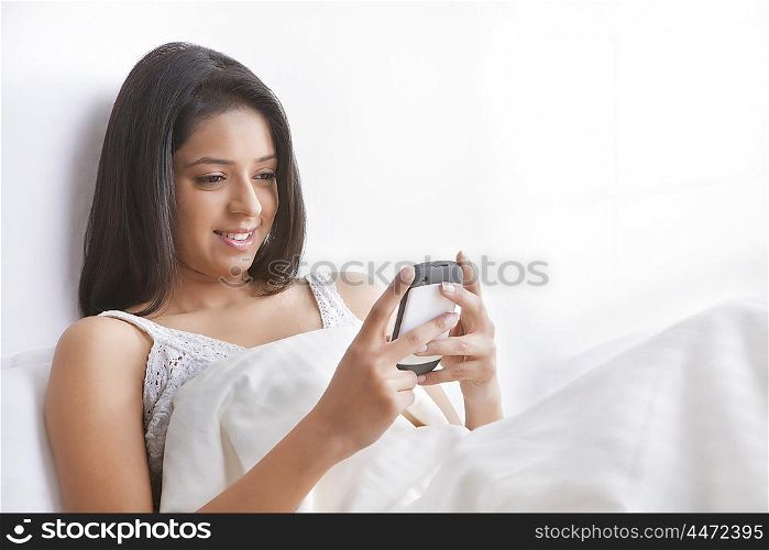 Girl reading sms on mobile phone