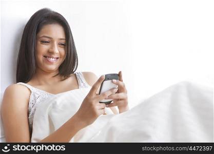 Girl reading sms on mobile phone