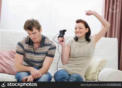 Girl rejoicing that beat boyfriend in console