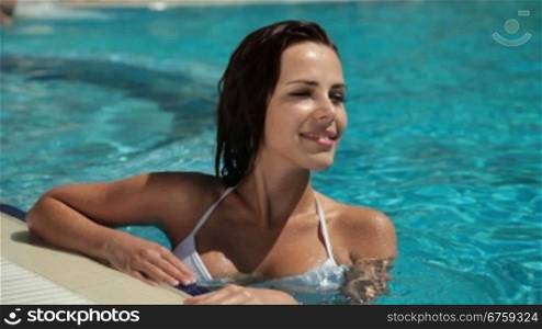 Girl Relaxing In Swimming Pool
