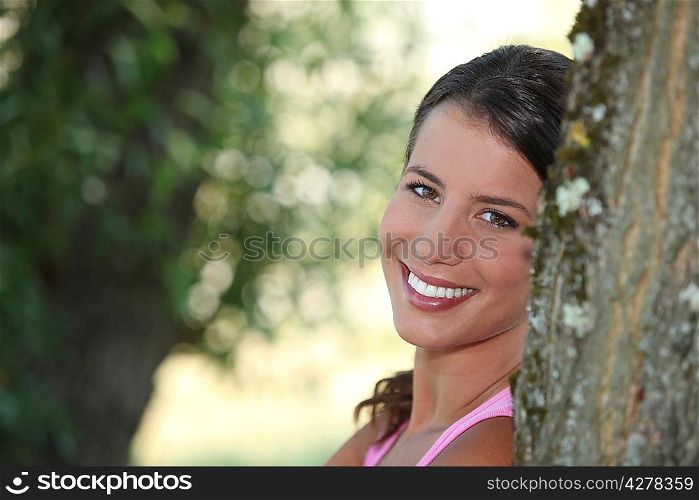 Girl relaxing under tree