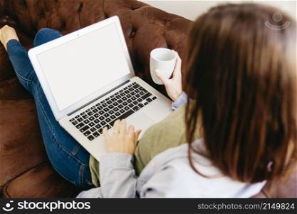 girl relaxing with drink laptop