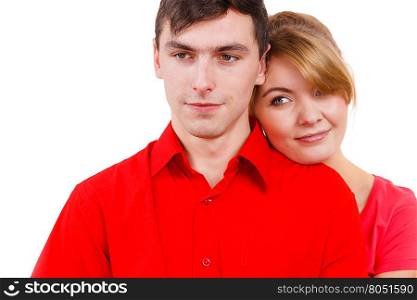 Girl rest with boyfriend.. Young beauty woman lean on man romantically. Couple wearing red clothes relaxing on date. Isolated on white.