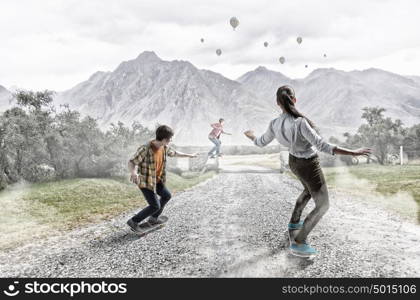 Girl ride skateboard. Active girl riding skateboard on countryside road