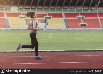 girl running athletic track