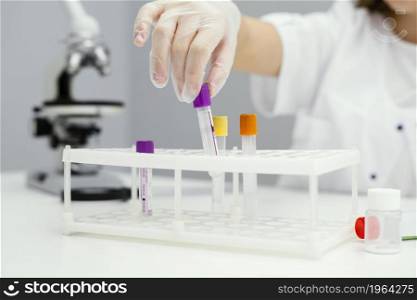 girl scientist with test tubes lab coat. High resolution photo. girl scientist with test tubes lab coat. High quality photo