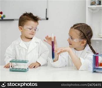 girl scientists doing experiments laboratory