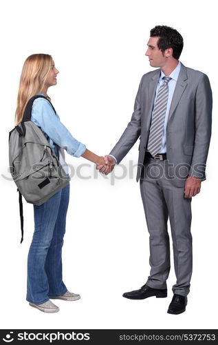 girl shaking hand with man