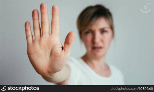 Girl showing stop gesture, close up of the hand
