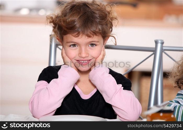 Girl sitting at table