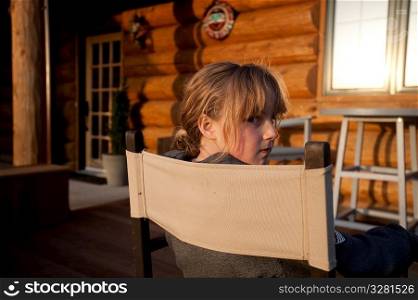 Girl sitting in a chair in Gimli, Manitoba, Canada