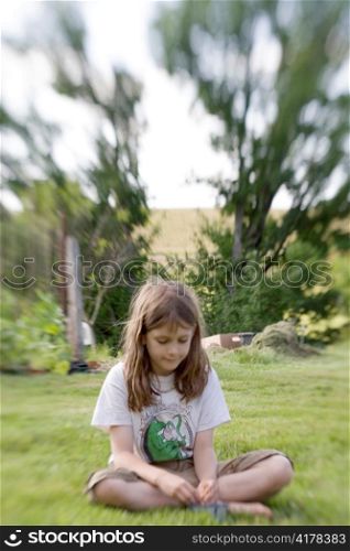 Girl Sitting in Grass