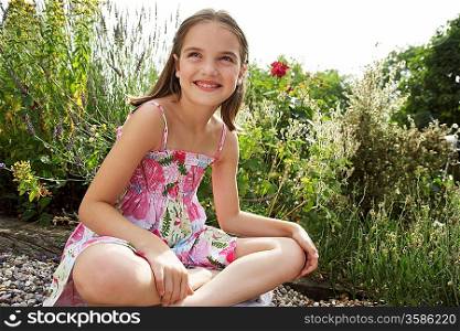Girl Sitting in Meadow