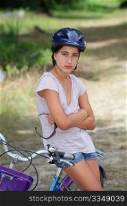 Girl sitting on a bicycle
