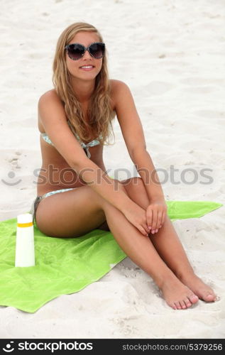 Girl sitting on the beach